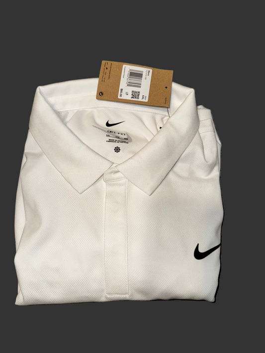 Folded white shirt with Nike logo on a black background